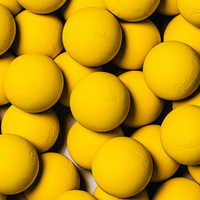 Pile of bright yellow Goaliesmith soft lacrosse practice balls