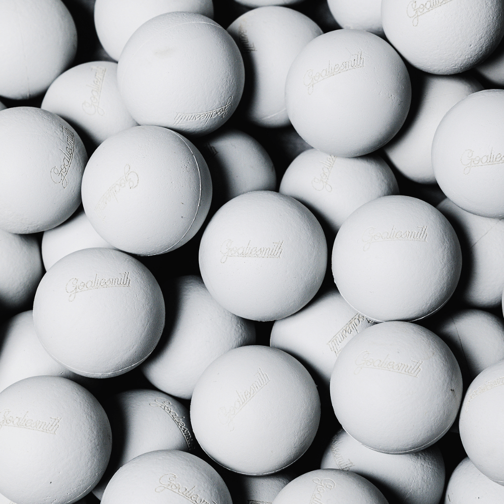 Pile of white Goaliesmith soft lacrosse practice balls
