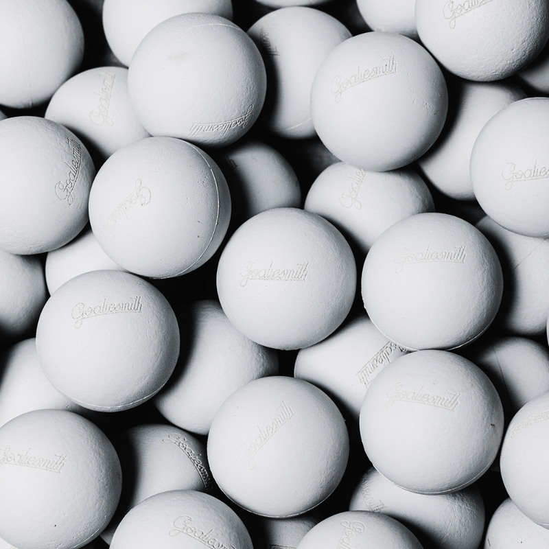 Pile of white Goaliesmith soft lacrosse practice balls
