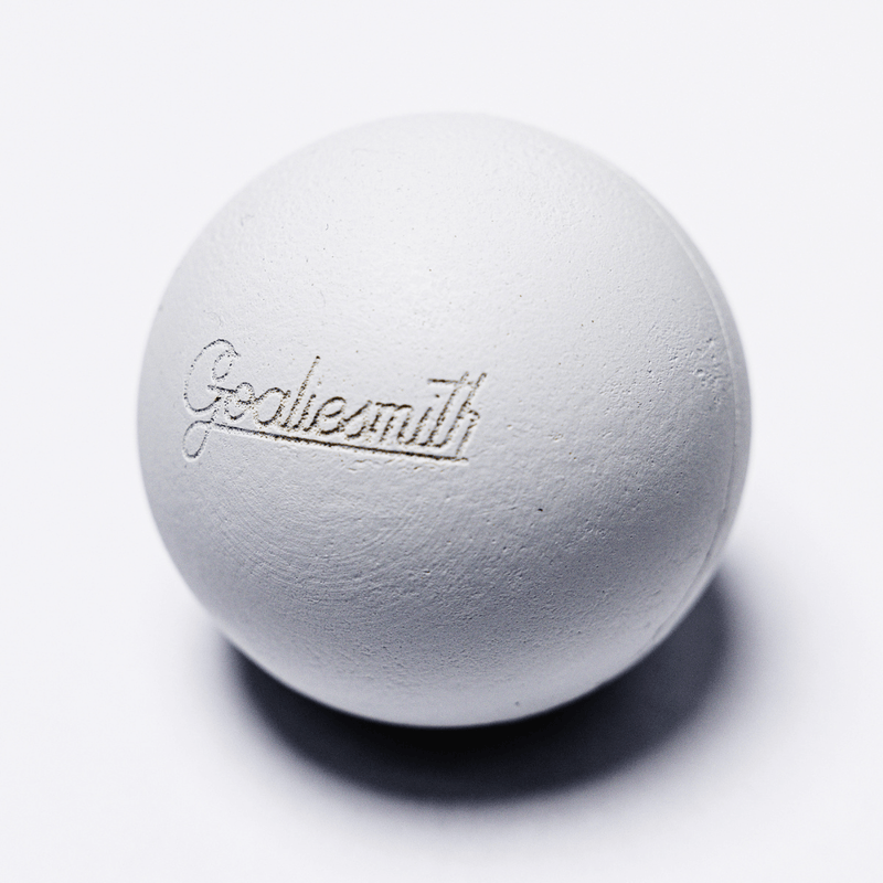 White soft lacrosse practice ball with embossed Goaliesmith logo